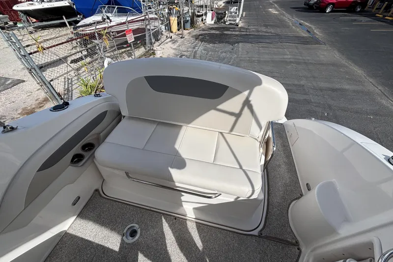 Slide: The Image of 2007 Chaparral Signature 250 boat interior with cushioned seating and cup holders. - 12