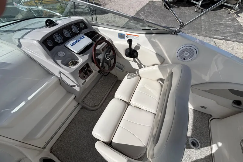 Slide: The Image of 2007 Chaparral Signature 250 boat cockpit with steering wheel and control panel. - 13