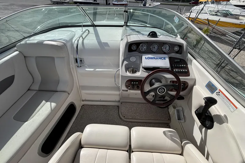 Slide: The Image of 2007 Chaparral Signature 250 boat interior with steering wheel and control panel. - 14