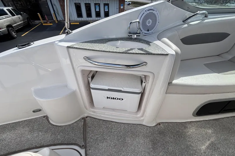 Slide: The Image of 2007 Chaparral Signature 250 boat interior with sink and Igloo cooler storage. - 18