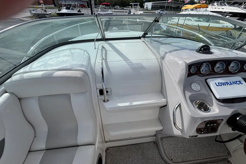 Slide: The Image of 2007 Chaparral Signature 250 boat interior with dashboard and seating area. - 20