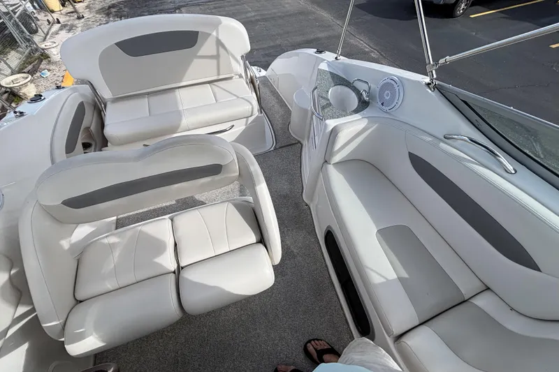 Slide: The Image of 2007 Chaparral Signature 250 boat interior with white seating and speaker system. - 23