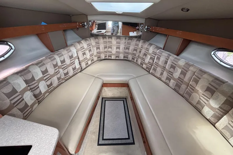 Slide: The Image of 2007 Chaparral Signature 250 cabin interior with patterned seating and skylight. - 25