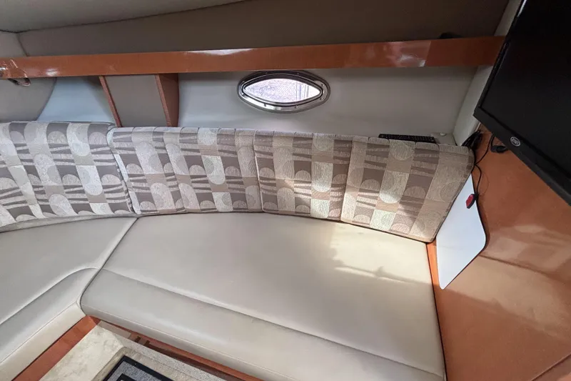 Slide: The Image of Interior of 2007 Chaparral Signature 250 boat with patterned seating and small window. - 28