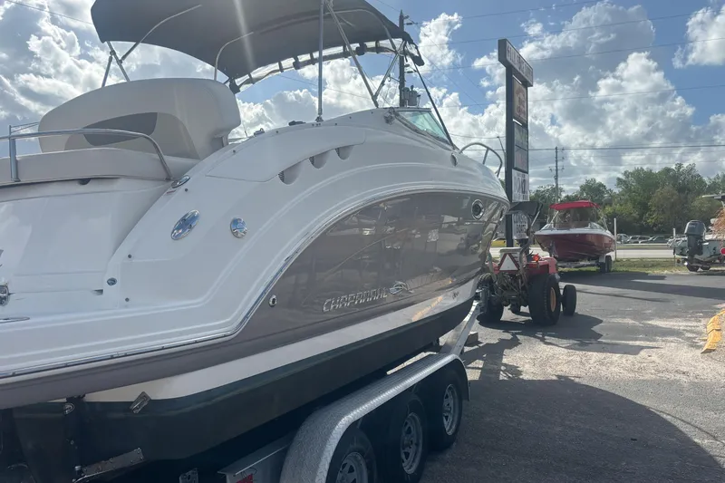 Slide: The Image of 2007 Chaparral Signature 250 boat on trailer under cloudy sky. - 3