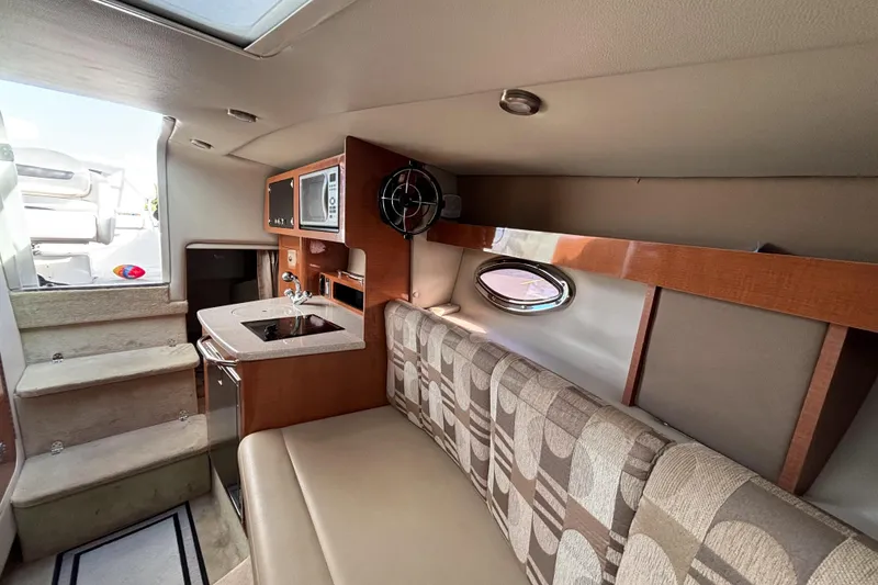 Slide: The Image of 2007 Chaparral Signature 250 cabin interior with kitchenette and seating area. - 31
