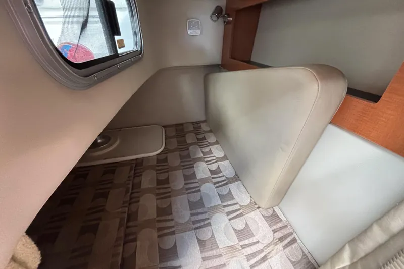 Slide: The Image of 2007 Chaparral Signature 250 cabin interior with patterned flooring and window view. - 35