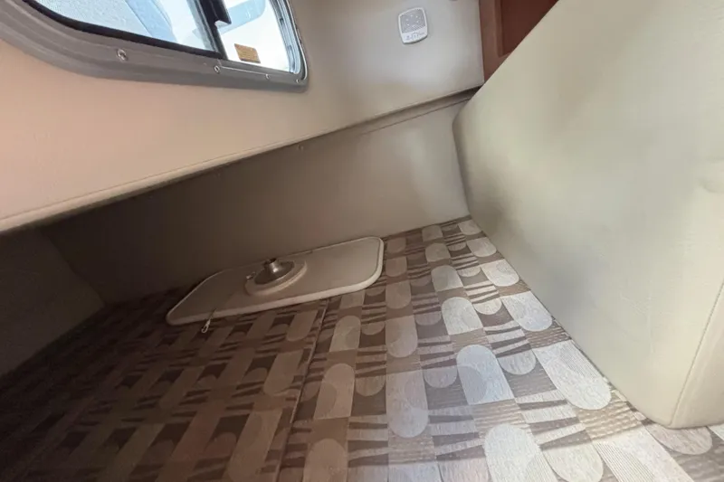 Slide: The Image of 2007 Chaparral Signature 250 cabin interior with patterned flooring and window. - 36