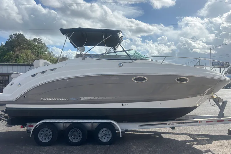 Slide: The Image of 2007 Chaparral Signature 250 boat on trailer under cloudy sky. - 4