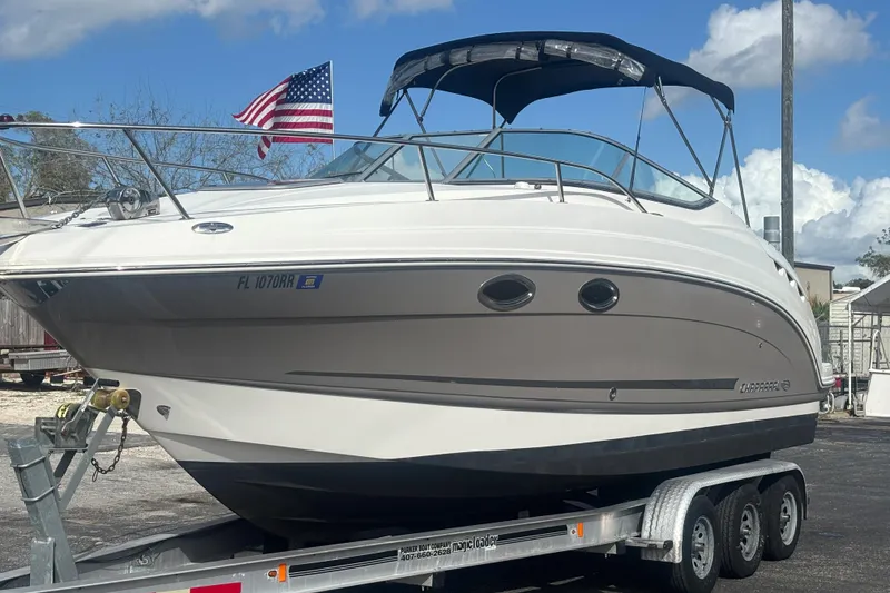 Slide: The Image of 2007 Chaparral Signature 250 boat on trailer with American flag in background. - 7