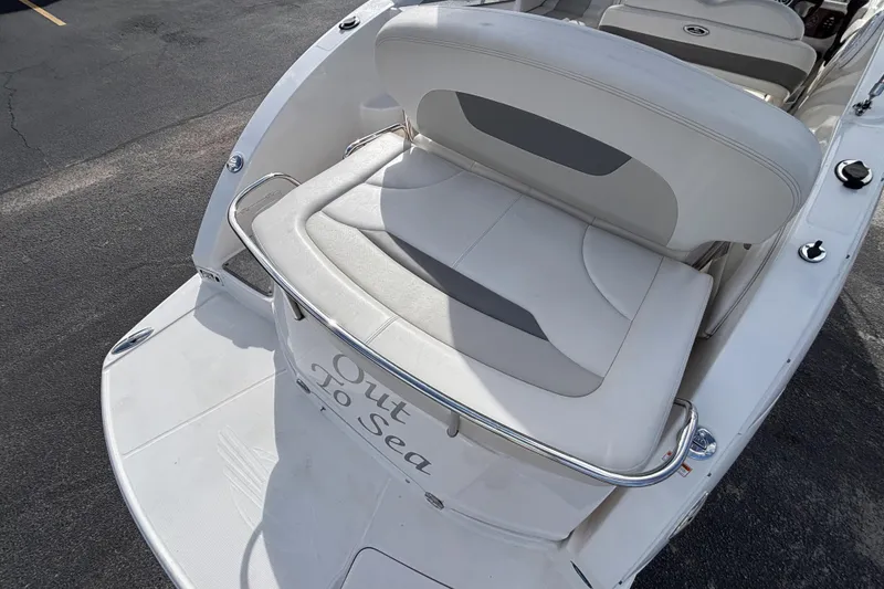 Slide: The Image of 2007 Chaparral Signature 250 boat with white seating and "Out To Sea" text on the back. - 8