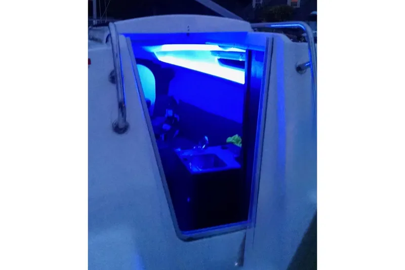 Slide: The Image of Cockpit of 2008 Hunter 27 sailboat with navigation instruments and compass. - 10