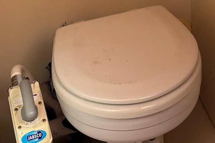 Slide: The Image of Marine toilet with Jabsco pump in a 2008 Hunter 27 sailboat. - 21