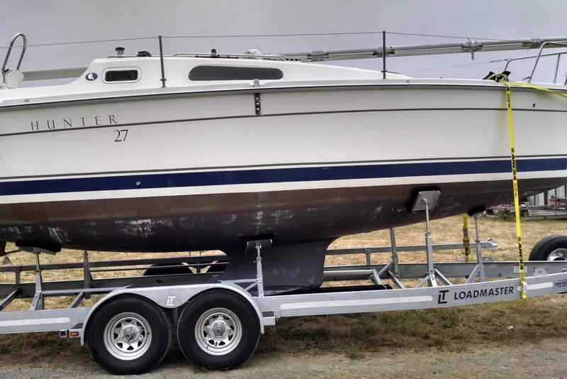 Slide: The Image of 2008 Hunter 27 sailboat on a trailer. - 5
