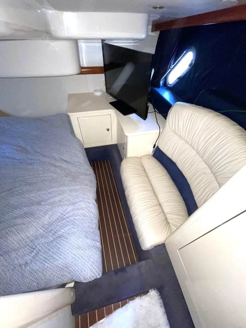 Slide: The Image of Interior of 2004 Cranchi Endurance 41 yacht with bed and sofa. - 12