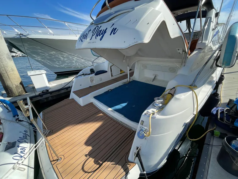 Slide: The Image of 2004 Cranchi Endurance 41 yacht docked at marina. - 14