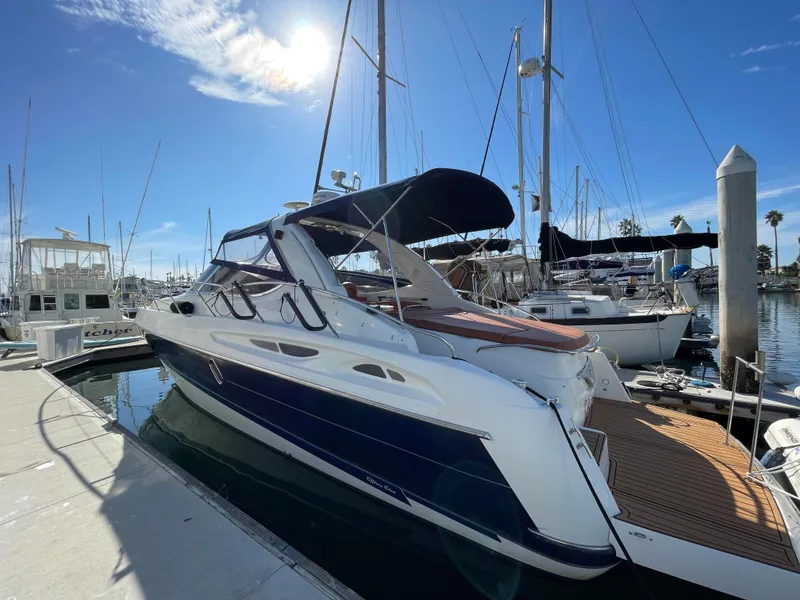 Slide: The Image of 2004 Cranchi Endurance 41 yacht docked in sunny marina. - 2