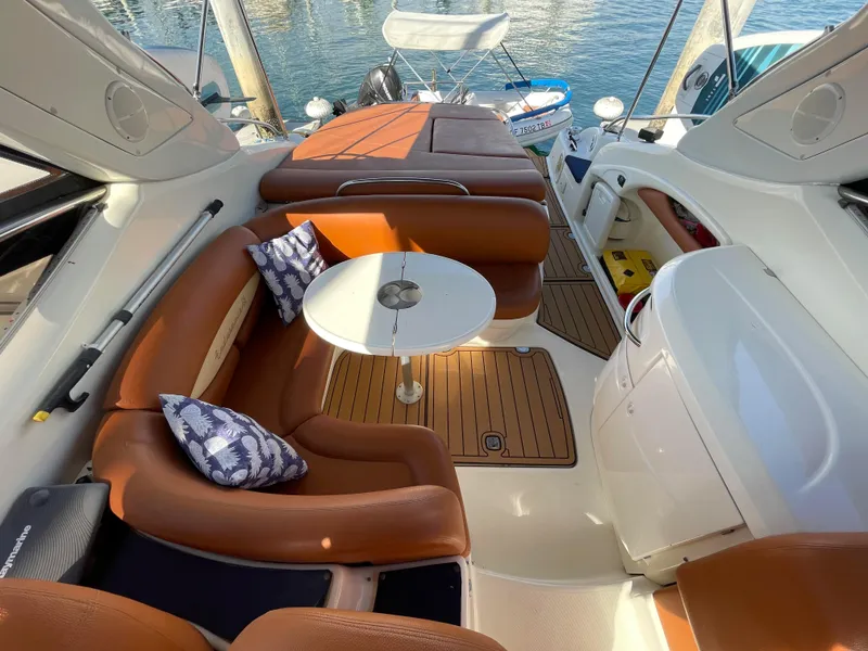 Slide: The Image of Interior of a 2004 Cranchi Endurance 41 yacht with brown leather seating. - 21