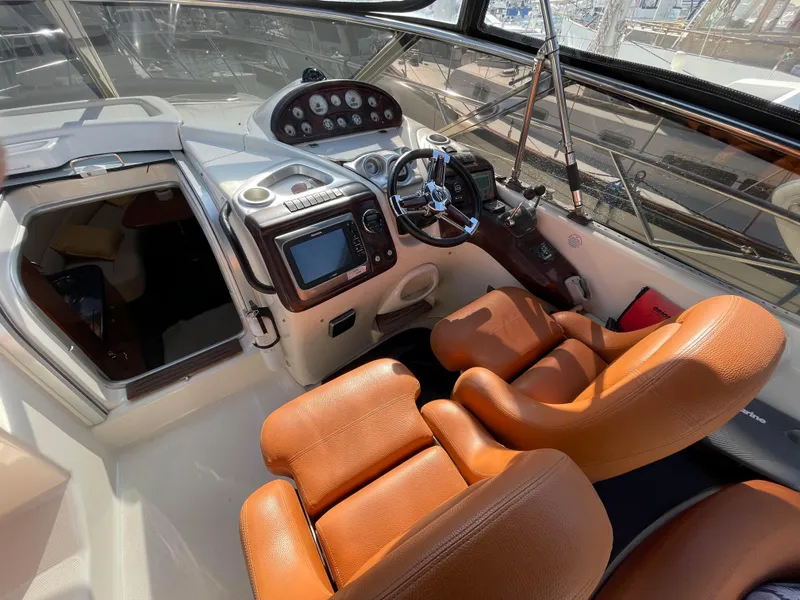 Slide: The Image of Interior of 2004 Cranchi Endurance 41 with brown leather seats. - 22