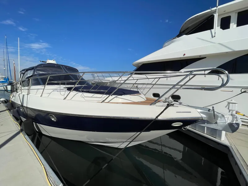 Slide: The Image of 2004 Cranchi Endurance 41 yacht docked at marina. - 33