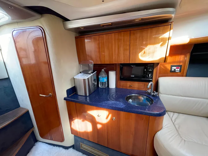 Slide: The Image of Interior of 2004 Cranchi Endurance 41 yacht featuring modern kitchenette. - 5