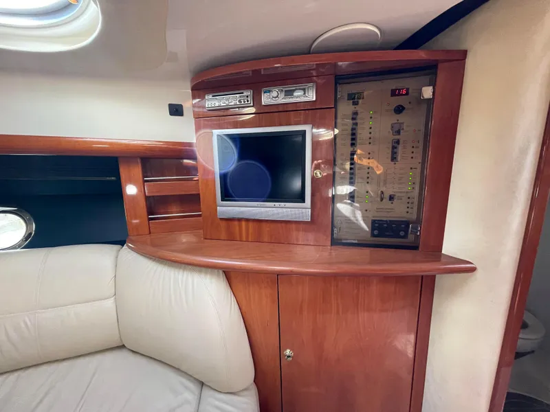 Slide: The Image of Interior of 2004 Cranchi Endurance 41 yacht with wood paneling and entertainment system. - 6