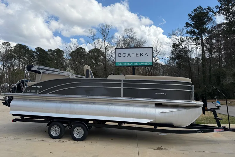 The Image of 2024 Harris Cruiser 230 pontoon boat on trailer at Boateka dealership. - 0