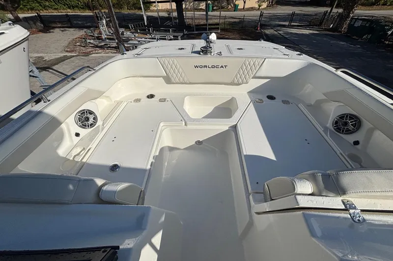 Slide: The Image of 2026 World Cat 265 DC-X boat interior with seating and speakers. - 2