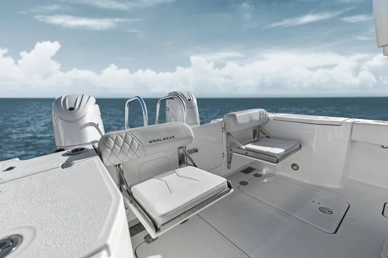 Slide: The Image of Manufacturer Provided Image: 2026 World Cat 265 DC-X boat interior with ocean view, featuring sleek seating and dual engines. - 5
