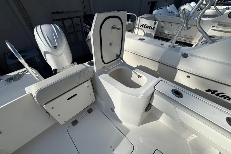 Slide: The Image of 2026 World Cat 265 DC-X boat interior with open storage compartment and seating. - 7