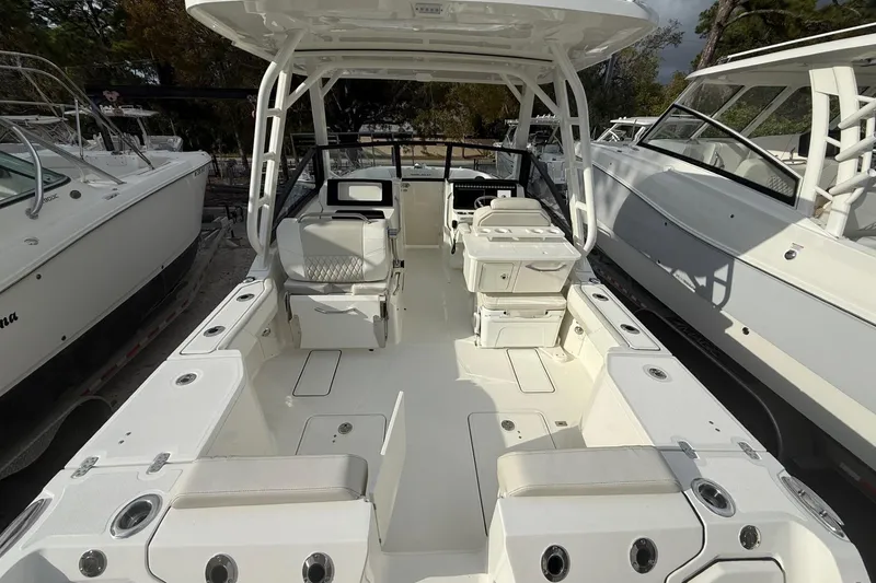 Slide: The Image of 2026 World Cat 265 DC-X boat interior with seating and storage compartments. - 9