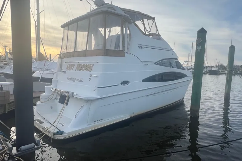 Slide: The Image of 2004 Carver 366 Motor Yacht docked at marina, Washington, NC, during sunset. - 12