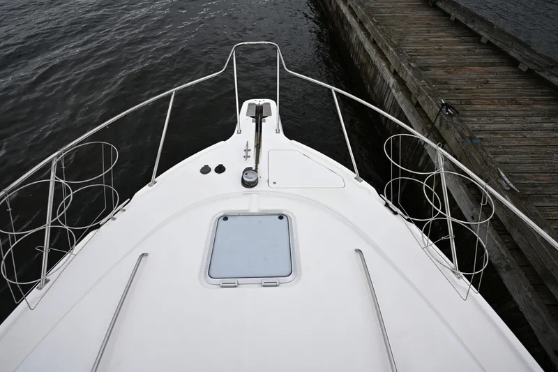 Slide: The Image of 1996 Bayliner 4087 Aft Cabin Motoryacht bow view at dock. - 12