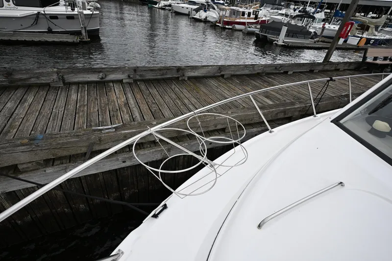 Slide: The Image of 1996 Bayliner 4087 Aft Cabin Motoryacht docked at a marina, wooden pier visible. - 17