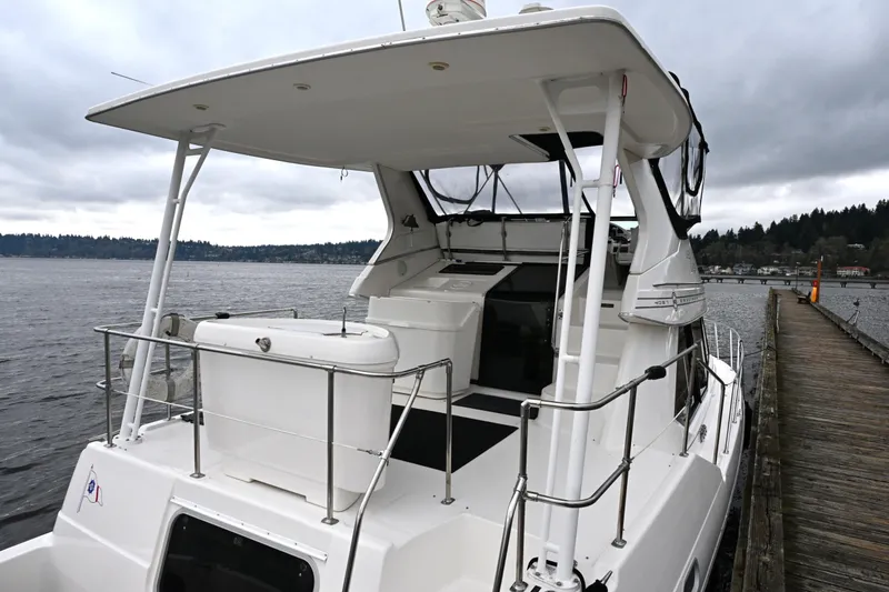 Slide: The Image of 1996 Bayliner 4087 Aft Cabin Motoryacht docked on a cloudy day. - 19