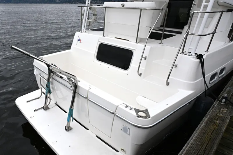 Slide: The Image of 1996 Bayliner 4087 Aft Cabin Motoryacht docked, showcasing spacious aft deck and sleek design. - 20
