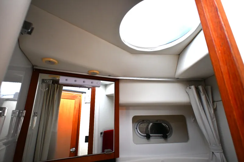 Slide: The Image of Interior of 1996 Bayliner 4087 Aft Cabin Motoryacht bathroom with skylight and mirror. - 35