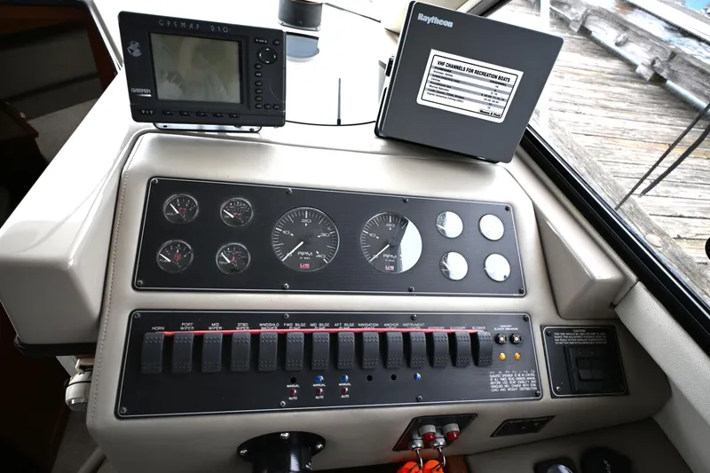 Slide: The Image of Control panel of a 1996 Bayliner 4087 Aft Cabin Motoryacht with navigation instruments. - 60