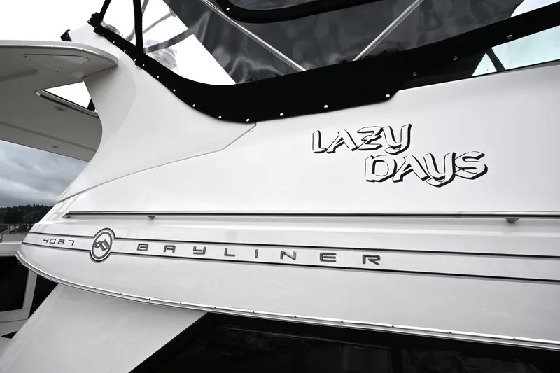 Slide: The Image of 1996 Bayliner 4087 Aft Cabin Motoryacht with "Lazy Days" name on hull. - 65