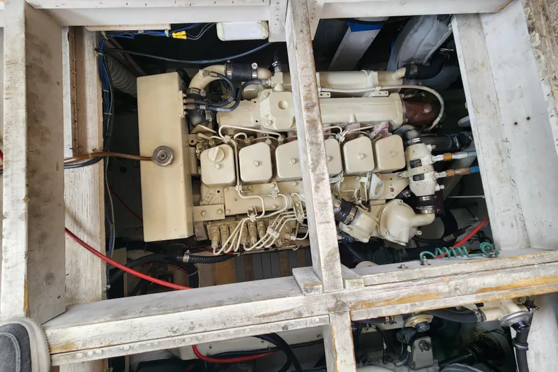 Slide: The Image of Engine compartment of a 1996 Bayliner 4087 Aft Cabin Motoryacht, showcasing mechanical components. - 68