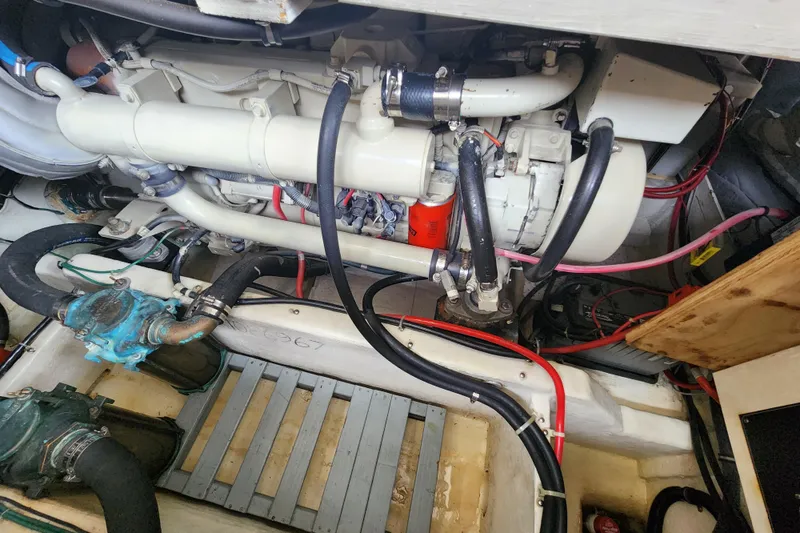 Slide: The Image of Engine compartment of a 1996 Bayliner 4087 Aft Cabin Motoryacht, showcasing mechanical components. - 69