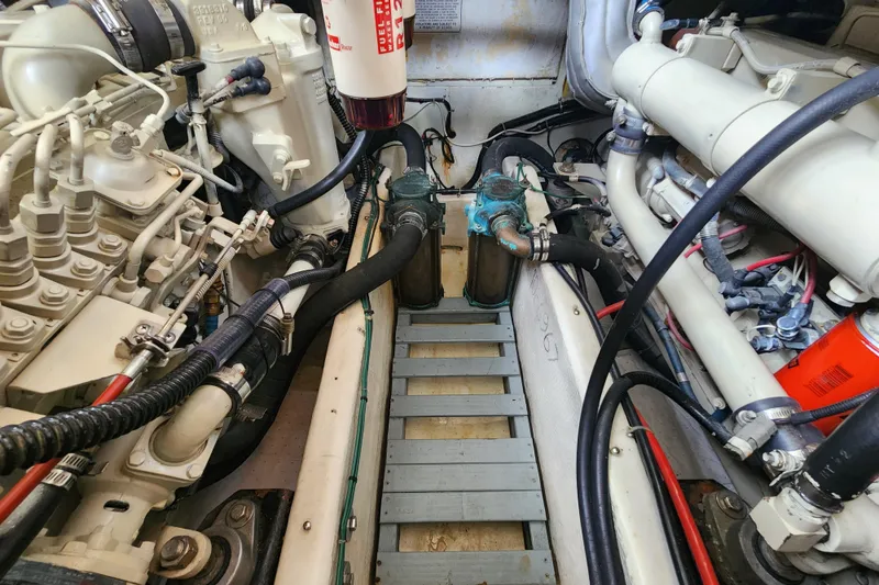 Slide: The Image of Engine room of a 1996 Bayliner 4087 Aft Cabin Motoryacht, showcasing mechanical components. - 70