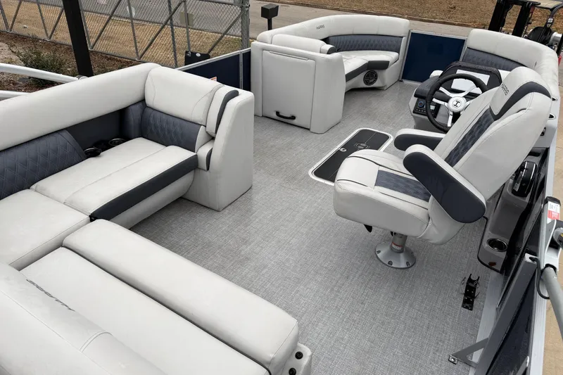 Slide: The Image of 2025 Harris Sunliner 230 pontoon boat interior with luxurious seating and modern design. - 2