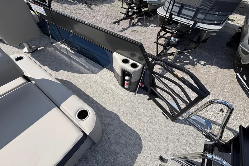 Slide: The Image of 2026 Berkshire 22UL LE B pontoon boat interior with seating and cup holders. - 10