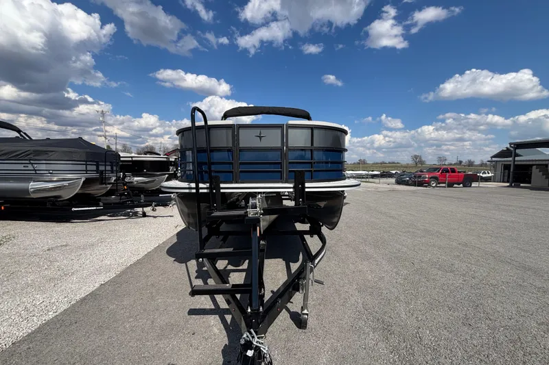 Slide: The Image of 2026 Berkshire 22UL LE B pontoon boat on trailer under a blue sky. - 11