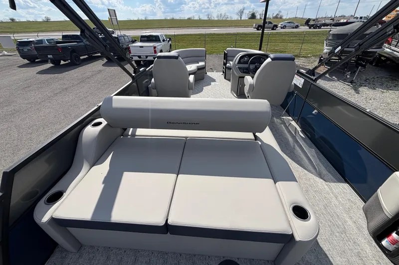 Slide: The Image of 2026 Berkshire 22UL LE B pontoon boat interior with plush seating and modern dashboard. - 8
