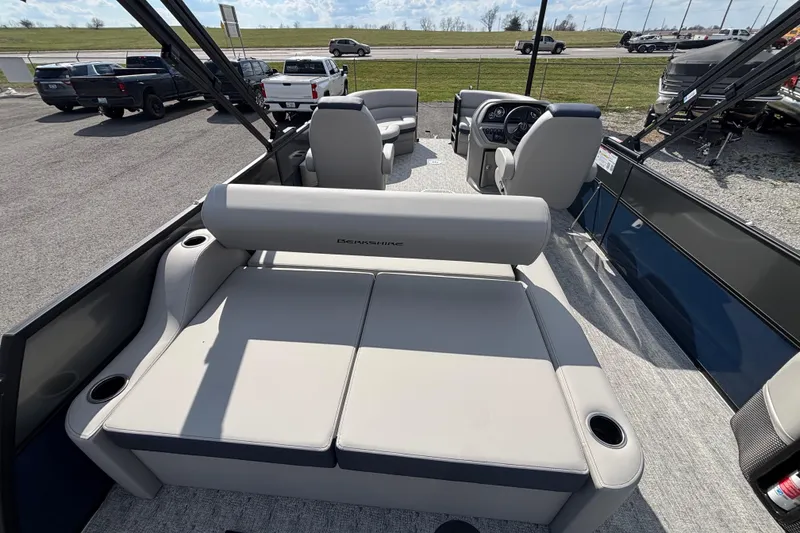 Slide: The Image of 2026 Berkshire 22UL LE B pontoon boat interior with plush seating and modern dashboard. - 9