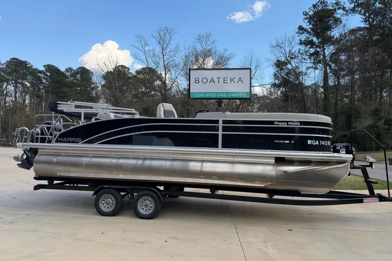The Image of 2024 Harris Cruiser 230 pontoon boat on trailer at Boateka dealership. - 0