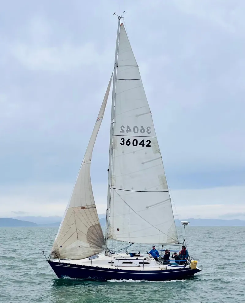 Slide: The Image of 1982 Schock NY 36 sailboat on calm waters. - 1