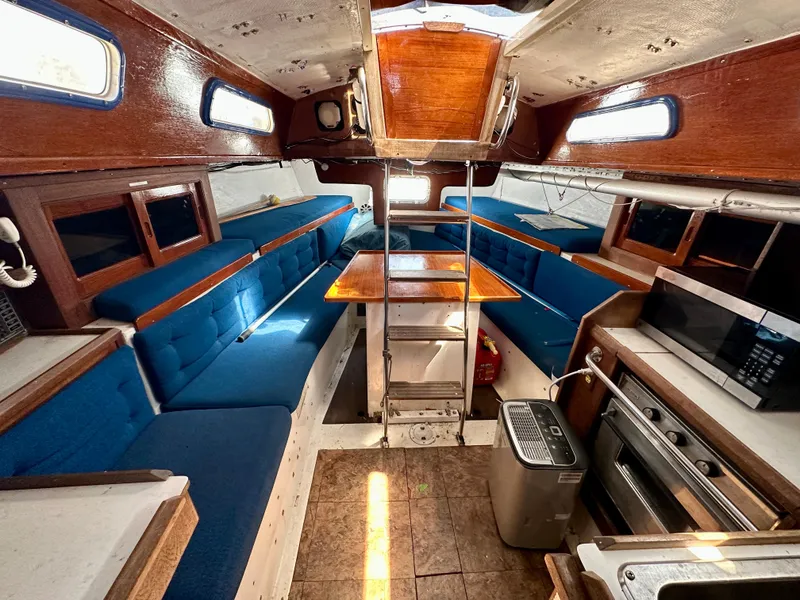 Slide: The Image of Interior of a 1982 Schock NY 36 yacht with blue upholstery. - 11